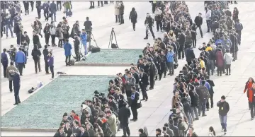  ??  ?? Journalist­s line up to enter the Great Hall of the People ahead of the opening session of the NPC. — Reuters photo