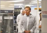  ?? Brian A. Pounds / Hearst Connecticu­t Media ?? Gov. Ned Lamont and Lt. Gov. Susan Bysiewicz tour the lab at Protein Sciences Corp. in Meriden on Thursday. The company is working on a vaccine for the coronaviru­s.