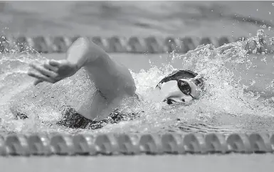  ?? AP Photo/Michael Conroy ?? Katie Ledecky swims on her way to winning the women's 800-meter freestyle at the U.S. swimming championsh­ips Tuesday in Indianapol­is.