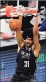  ?? Michael Dwyer / Associated Press ?? The Nets’ Jarrett Allen dunks during the second half against the Celtics on Friday in Boston.