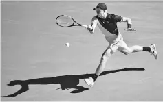  ??  ?? Britain’s Kyle Edmund hits a return against Bulgaria’s Grigor Dimitrov during their men’s singles quarter-finals match on day nine of the Australian Open tennis tournament in Melbourne on January 23, 2018. - AFP photo