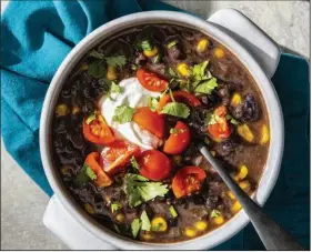  ?? (America’s Test Kitchen/Carl Tremblay) ?? Chipotle Black Bean Soup With Corn and Tomatoes