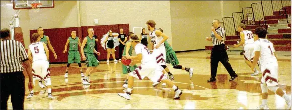  ?? MARK HUMPHREY ENTERPRISE-LEADER ?? Lincoln senior Harrison Swayne brings the ball up with his left hand against Greenland. Throughout Friday’s 72-51 win, Lincoln put pressure on the backpedali­ng Pirates.