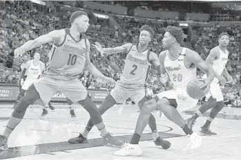  ?? GASTON DE CARDENAS/AP ?? Miami Heat forward Justise Winslow, right, had as many points Saturday against Memphis as he had in his previous five games.