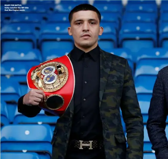  ??  ?? READY FOR BATTLE: Selby clutches the IBF title that Warrington wants