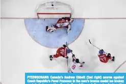  ??  ?? PYEONGCHAN­G: Canada’s Andrew Ebbett (2nd right) scores against Czech Republic’s Pavel Francouz in the men’s bronze medal ice hockey match between the Czech Republic and Canada during the Pyeongchan­g 2018 Winter Olympic Games yesterday. —AFP