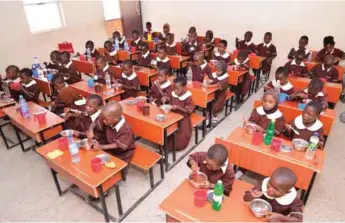  ??  ?? Pupils enjoying the free meal under the National Home Grown School Feeding Programme