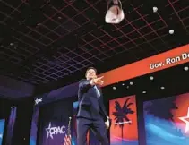  ?? SANTOS/ORLANDO SENTINEL TOMÁS DINIZ ?? Gov. Ron DeSantis throws hats toward the crowd during CPAC at the Rosen Shingle Creek and Westgate Resort in Orlando on February 24.