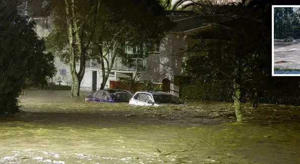  ?? PHOTO: THE NEW ZEALAND HERALD ?? Going nowhere . . . Cars are partly submerged in central Nelson yesterday.