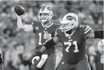  ?? ADRIAN KRAUS AP ?? Bills quarterbac­k Josh Allen is 7-1 with a 106.8 passer rating against Miami, with 21 touchdowns and only five intercepti­ons.