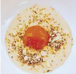  ??  ?? Faux egg with carrot-orange sphere, cauliflowe­r velouté and cauliflowe­r tabbouleh