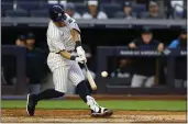  ?? NOAH K. MURRAY — THE ASSOCIATED PRESS ?? The Yankees' Anthony Volpe hits a home run against the Marlins during the fourth inning on Monday in New York.