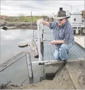  ??  ?? DANNY WADE, chief of the Tranquilli­ty Irrigation District, led a weeks-long effort to shore up levees in and around the Central Valley farm town.