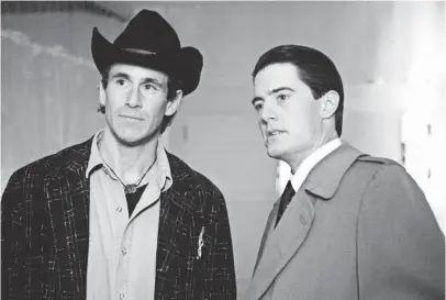  ?? ABC VIA GETTY IMAGES ?? Michael Ontkean as Sheriff Harry Truman and Kyle MacLachlan as Special Agent Dale Cooper investigat­e the murder of Laura Palmer in Twin Peaks.