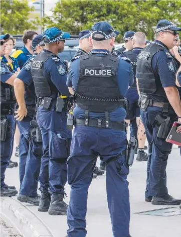  ??  ?? Police gather at a Gold Coast train station as part of Operation Romeo Luminous targeting antisocial