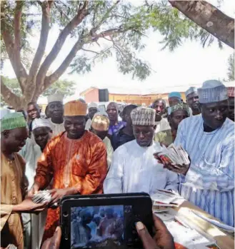  ?? PHOTO: ISA SA’IDU ?? Farmers receiving free tomato seeds at Maigana, Soba LGA of Kaduna State