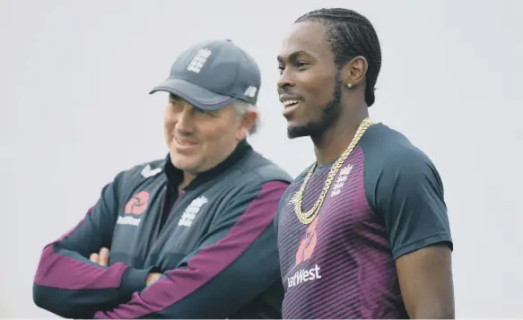  ??  ?? Jofra Archer talks to England head coach Chris Silverwood during a nets session at Old Trafford.