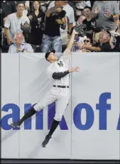  ?? Julie Jacobson The Associated Press ?? Yankees right fielder Aaron Judge tries to field a ball hit for a ground-rule double by Rafael Devers in the seventh inning of the Red Sox’s 11-0 win Saturday.