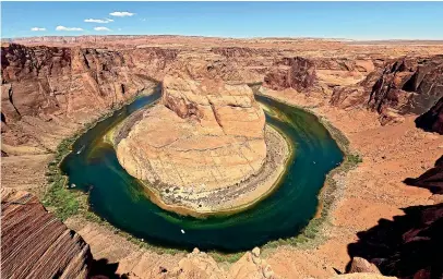  ?? AP ?? The Colorado River flows at Horseshoe Bend in the Glen Canyon National Recreation Area in Page, Arizona. Seven states in the US West were facing a deadline from the federal government to come up with a plan to use substantia­lly less Colorado River water in 2023.