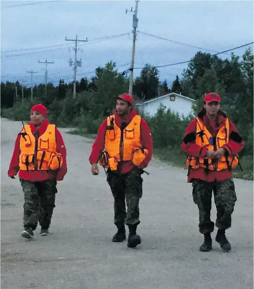  ?? WARRANT OFFICER BARRY BORTON / CANADIAN ARMY ?? Members of the Canadian Rangers set out for their nightly patrols in the Wapekeka First Nation, which has declared a state of emergency following a series of youth suicides.