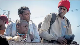  ?? Aidan Monaghan, Netflix ?? Rial ( Wunmi Mosaku), top left, the younger Nyagak ( Malaika Wakoli- Abigaba) and Boi ( Sope Dirisu) flee South Sudan for England in “His House.”