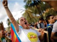  ??  ?? CRY FOR FREEDOM: A pro-independen­ce activist shouts slogans during a rally in Barcelona on Tuesday. —