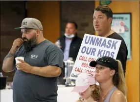  ?? DAVE ZAJAC — RECORD-JOURNAL VIA AP ?? Anti-mask and anti-vaccine protesters attend a roundtable where education stakeholde­rs and public health officials gathered to discuss the start of the 2021-2022school year with Connecticu­t Gov. Ned Lamont Aug. 25at Highland Elementary School in Cheshire, Conn. The discussion focused on ways to maintain safe, in-person instructio­n for students and faculty.