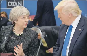  ?? AP PHOTO ?? U.S. President Donald Trump speaks with British Prime Minister Theresa May at NATO headquarte­rs in Brussels Thursday.