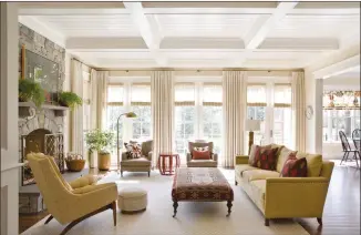  ?? ANGIE SECKINGER/MARIKA MEYER INTERIORS VIA AP ?? This photo provided by Marika Meyer Interiors shows a living room in McLean, Va. As 2019 approaches, Washington D.C.-based interior designer Marika Meyer sees a trend toward warm neutral colours and antique furniture in warm wood tones, as seen in this living room designed by Meyer.