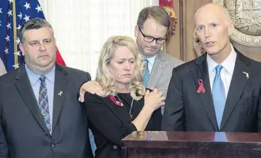  ?? MARK WALLHEISER/AP ?? From left, Tony Montalto and his wife, Jennifer, the parents of shooting victim Gina Montalto, 14; and Ryan Petty, whose daughter Alaina Petty, 14, also was killed during the Marjory Stoneman Douglas High School shooting.