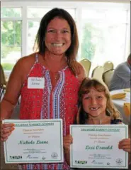 ?? MICHILEA PATTERSON — FOR DIGITAL FIRST MEDIA ?? Nichole Leone, of Pottstown, poses with her daughter Lexi Oswald, 7, at the Home Garden Contest awards ceremony held on July 22 at Brookside County Club. Both mother and daughter took home first place prizes. Leone took first place in the flower category and Oswald came in first place for the young gardener category.