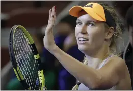  ?? MARK SCHIEFELBE­IN — THE ASSOCIATED PRESS, FILE ?? Caroline Wozniacki reacts after beating Daria Kasatkina in their quarterfin­al match at the China Open in Beijing on Oct. 4. Wozniacki announced on Friday she will retire after the Australian Open.