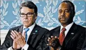  ?? PABLO MARTINEZ MONSIVAIS/AP ?? Former Texas Gov. Rick Perry, left, and retired neurosurge­on Ben Carson join President Donald Trump’s Cabinet.