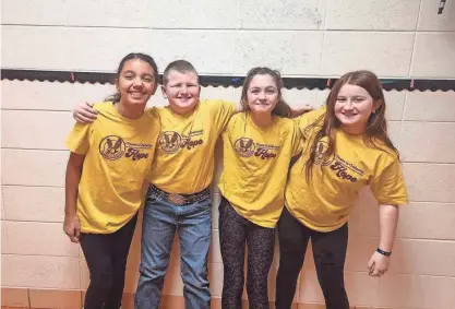  ?? PROVIDED BY SPOKANE SCHOOL DISTRICT MISSOURI ?? Spokane students Peyton Leigh, Cash Cutbirth, Hayden Rhoades and Mila Truitt show off the school’s There is Owlways Hope T-shirts that give a nod to the school’s mascot and remind students that there is always hope, especially when they participat­e in even small acts of kindness.