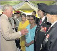  ??  ?? The Prince of Wales meets representa­tives from local and national veterans’ groups during a visit to the Commonweal­th War Graves in Taiping, Kuala Lumpa, Malaysia, during his 11-day autumn tour of Asia