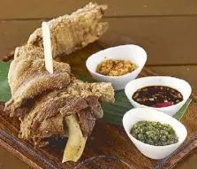  ??  ?? Livestock's crispy pata is so juicy and tender you can cut it with a popsicle stick.