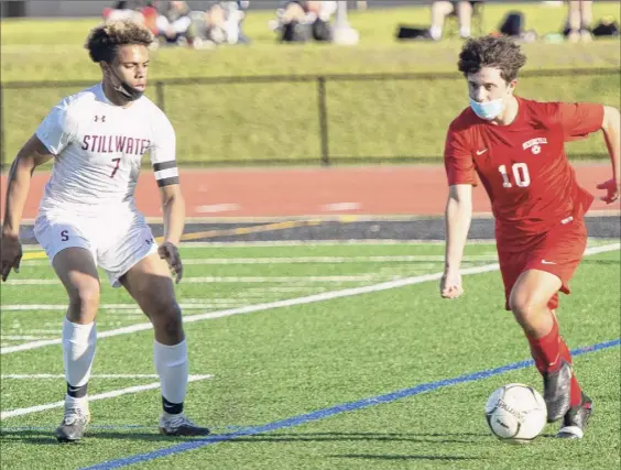  ?? Photos by Jenn March / Special to the Times Union ?? Mechanicvi­lle’s Andrew Kraszewski, right, had three goals and two assists. Here, Stillwater’s Isaac Cutler defends him on Wednesday.