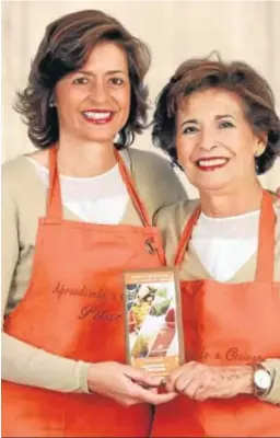  ?? DC. ?? Pilar y Cristina con su nuevo libro solidario y gastronómi­co.
