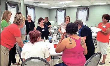  ??  ?? Unemployed and under-employed women in North Georgia meet to learn tools and life skills at a Bridge of Hope meeting.