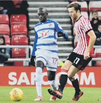  ??  ?? Sunderland’s Adam Matthews takes on Reading winger Modou Barrow. Picture by Frank Reid.