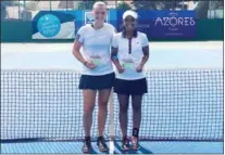  ?? SUPPLIED ?? Doubles partners Katharina Hering (left), from Germany, and Cambodia’s Andrea Ka show off their trophies after winning the ITF Azores Open Futures 2 in Portugal.