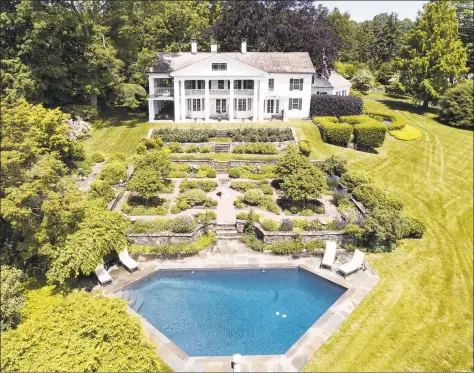  ?? Daniel Milstein Photograph­y / Contribute­d photo ?? This iconic six- acre estate at the top of Fairfield’s Greenfield Hill consists of a six- bedroom main house, two- bedroom guest house and 2,000 square- foot renovated party barn.