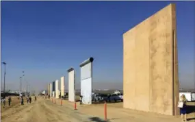  ?? ELLIOTT SPAGAT—THE ASSOCIATED PRESS ?? This Oct. 26, 2017, file photo shows prototypes of border walls in San Diego. President Donal Trump is heading to California on March 13, 2018, in his first visit to the state he loves to hate, since becoming president.