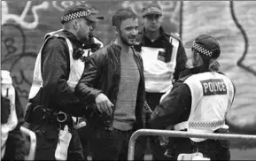  ??  ?? Rigorous stop and searches were carried out at various entrances to Notting Hill Carnival. (Photo: Evening Standard)