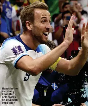  ?? ?? Hands in the air: Harry Kane (left) celebrates his goal with Phil Foden