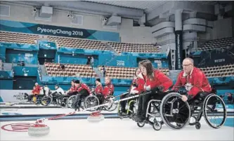  ?? JOEL MARKLUND THE ASSOCIATED PRESS ?? Canada’s Ina Forrest, second from right, and Dennis Thiessen, right, practise for the wheelchair curling at the Gangneung Curling Centre at the Pyeongchan­g 2018 Paralympic Winter Games Thursday.