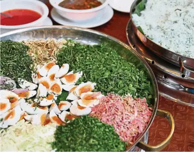  ??  ?? There’s only goodness in nasi ulam (pictured below) and nasi kerabu with its plethora of herbs like this Nasi Kerabu Ulam Setaman, to which you can easily add wild herbs that you forage yourself.