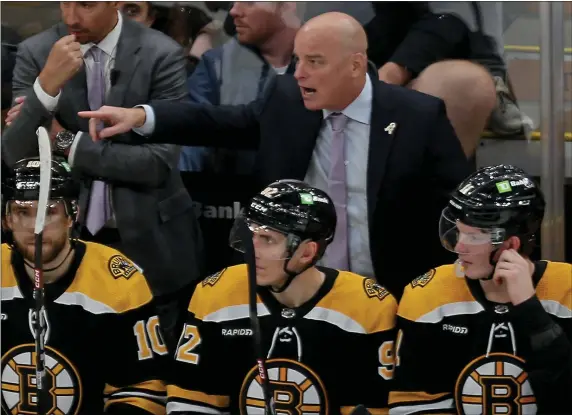  ?? STUART CAHILL — BOSTON HERALD ?? Bruins head coach Jim Montgomery yells at the ref as the Bruins take on the Stars at the TD Garden on Oct. 25. Entering Saturday night, the Bruins were 10-0 at home this season.