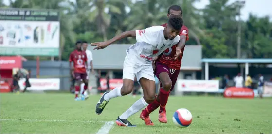  ?? Photo: Jone Luvenitoga ?? Suva defender Epeli Lairoti (left) against Rakiraki during the Vodafone Fiji FACT tournament on May 19, 2017 at Ratu Cakobau Park, Nausori.