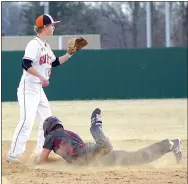  ?? Photo by Randy Moll ?? Gravette infielder Hunter Cole waits for a throw as Peyton Wright of Gentry slides safely into second during play between the two rivals at Gravette on March 16.